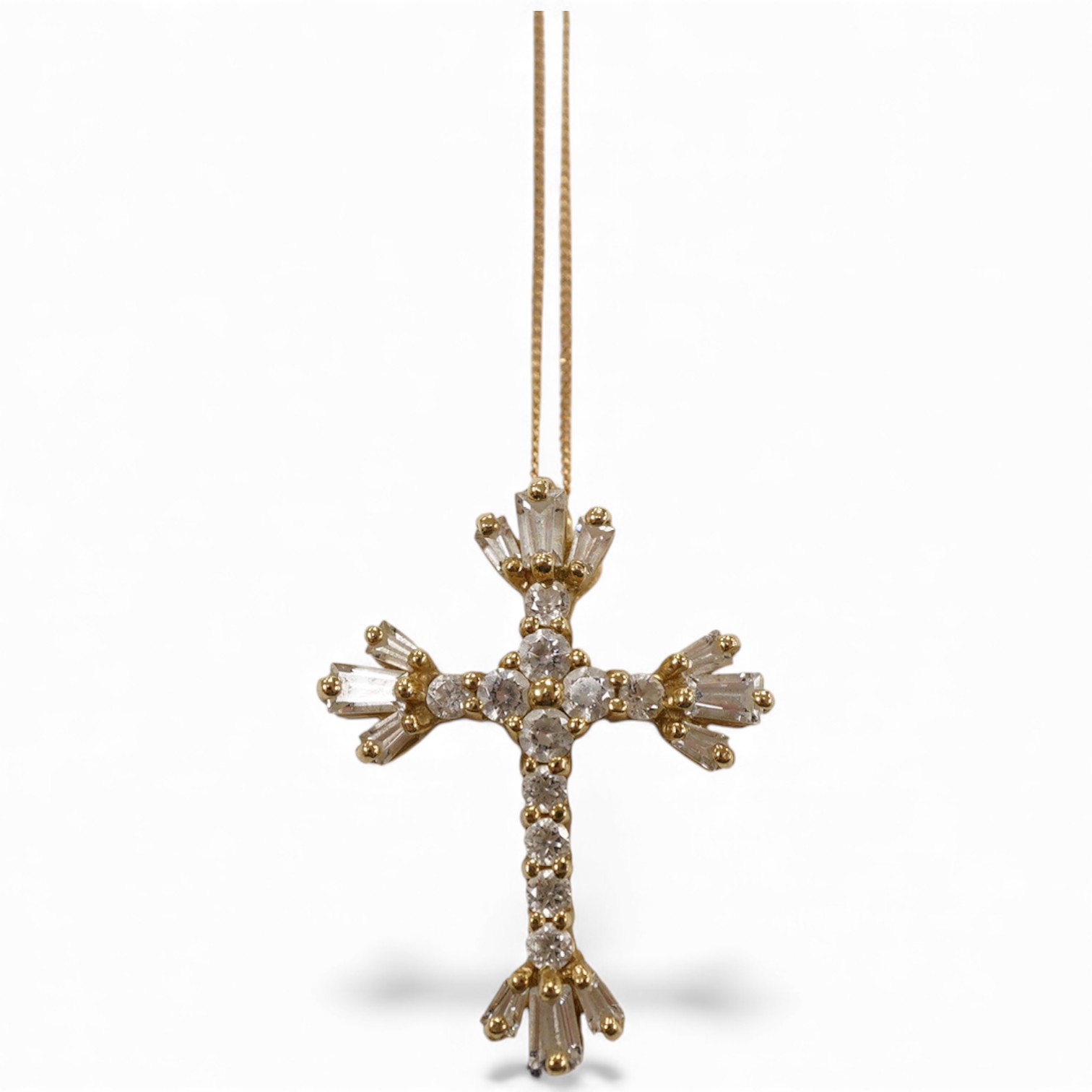 A recent 14k yellow metal and cubic zirconia cluster set cross pendant, 22mm, on a 585 yellow metal fine link chain(knotted).